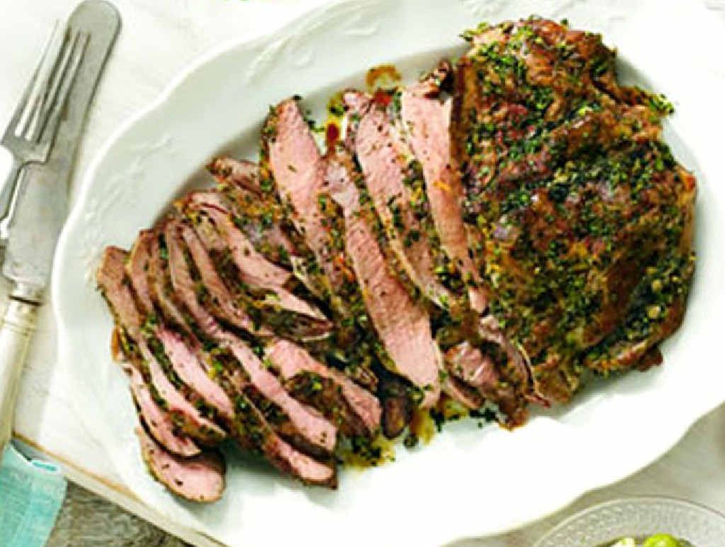 Barbecued butterflied lamb leg seasoned with parsley, capers and lemon. Barbecued butterflied lamb leg seasoned with parsley, capers and lemon.